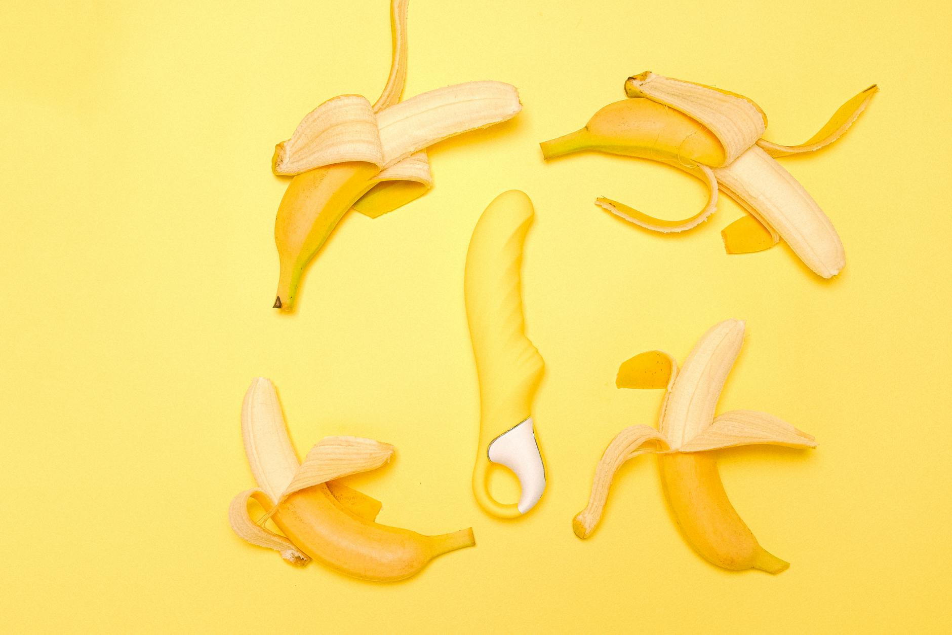 Yellow silicone lemon vibrator on a bright yellow background, symbolizing peak sensory pleasure